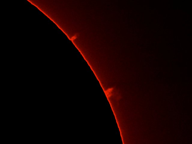 A solar prominance seen throuh a Hydrogen-alpha (H-a) filter.  The solar disc has been masked to enhance the prominance.