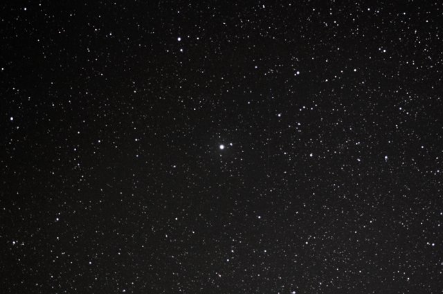 21 30-sec exposures from the D40 rotated and stacked to form a single image of the Northern Sky.  Polaris is the bright star in the center of the image.