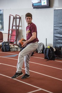 Matt Ham practices with a teammate tossing a medicine ball to build up strength for future games. Photo by Andrew Shepherd