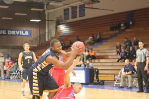 Donnell Bronson struggles for a rebound on the road against Kansas City Kansas Community College. The Cavs would lose the game 67-49 