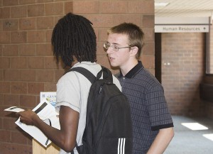 Student Senate president John Rives gives information to an interested student.