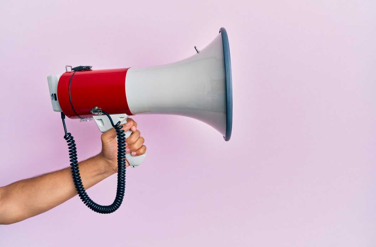 hand holding megaphone